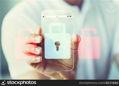 business, technology, security, protection and people concept - close up of male hand holding and showing transparent smartphone with lock icon on screen