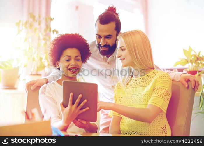 business, technology, startup and people concept - happy creative team with tablet pc computers in office