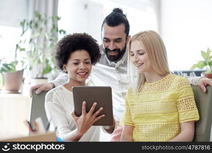 business, technology, startup and people concept - happy creative team with tablet pc computers in office