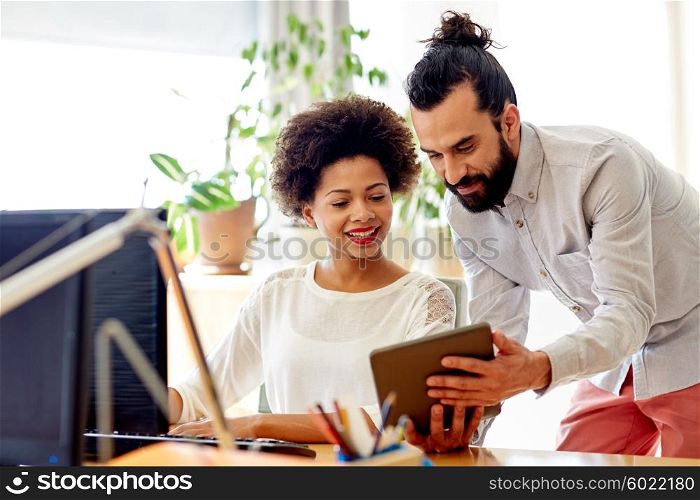 business, technology, startup and people concept - happy creative team with tablet pc computers in office
