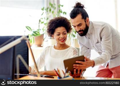 business, technology, startup and people concept - happy creative team with tablet pc computers in office