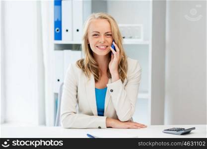 business, tecnology, communication and people concept - happy businesswoman calling on smartphone at office