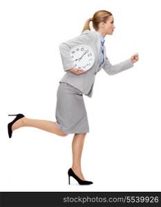 business, time and education concept - calm young businesswoman with clock running