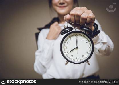 Business time clock or working hours morning times remind alert warning concept, People holding retro bell alarm clock.