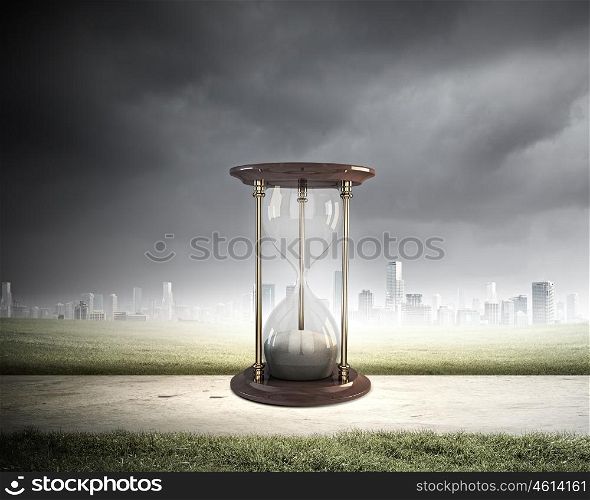 Business time. Conceptual image with huge sandglass. Time concept
