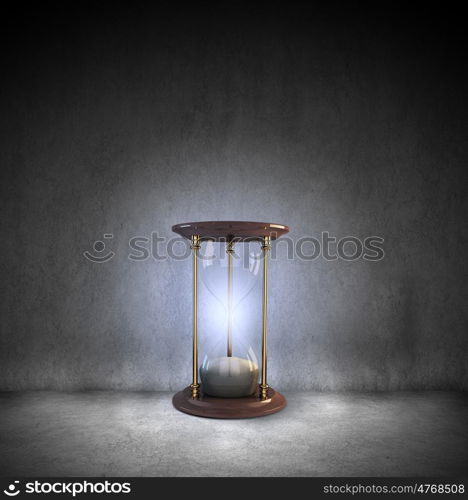 Business time. Conceptual image with huge sandglass. Time concept