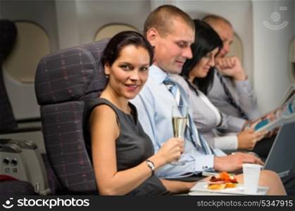 Business travel by airplane woman enjoy refreshment flight cabin passenger