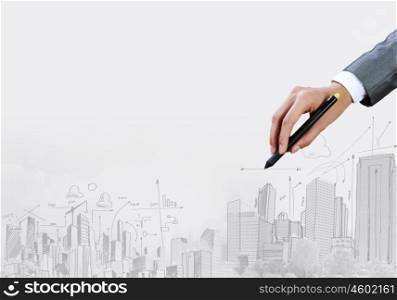 Business travel. Close up of businesswoman hand drawing sketches with marker