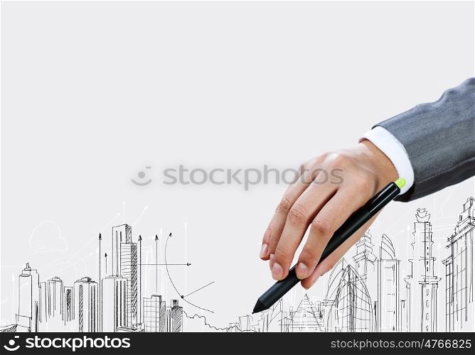 Business travel. Close up of businesswoman hand drawing sketches with marker