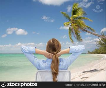 business, travel, tourism, vacation and people concept - businesswoman or teacher sitting on chair from back over tropical beach background
