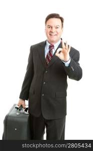 Business traveler with his luggage, giving the A Okay sign to show he&rsquo;s had a good trip. Isolated on white.