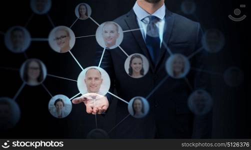 business, virtual reality, future technology, cyberspace and people - businessman with network contacts over black background. businessman with network contacts over black