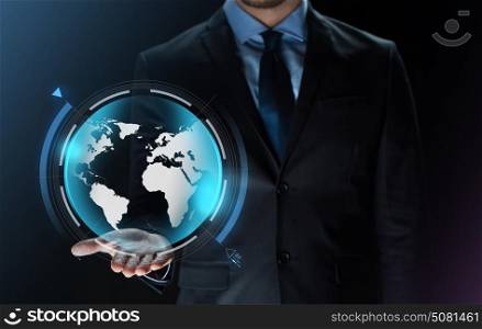 business, virtual reality, people and future technology concept - close up of businessman in suit with earth projection on hand over dark background. close up of businessman with earth projection