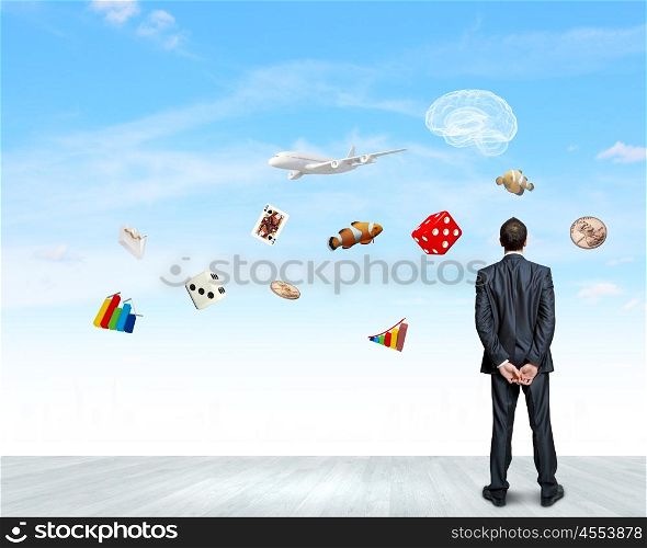 Business vision. Back view of confident businessman dreaming about future