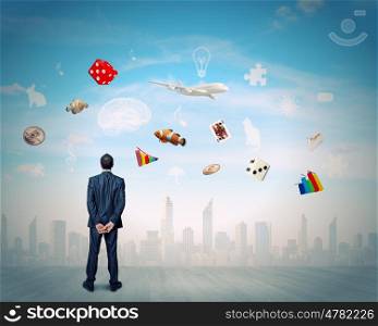 Business vision. Back view of confident businessman dreaming about future