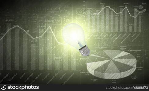 Business vision. Glowing light bulb with sketches at background