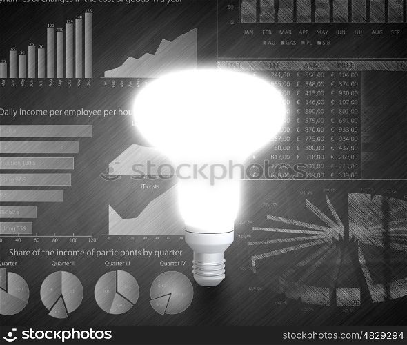 Business vision. Glowing light bulb with sketches at background