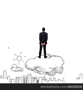 Business vision. Rear view of businessman standing on cloud and looking at city