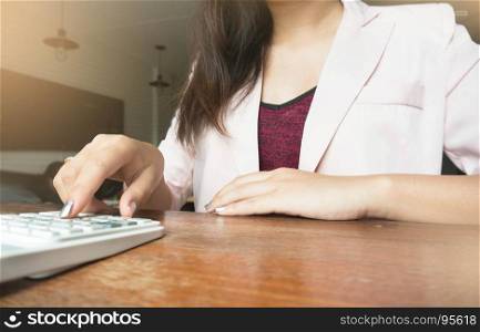 Business woman analyzing investment charts with calculator laptop. Accounting and technology in office.Business people using laptop at office Analyze plans.selective focus.