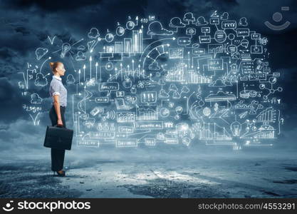 Business woman and business project. Side view image of businesswoman standing against business sketch