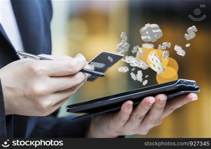 Business woman are shopping online by using mobile phone and credit card