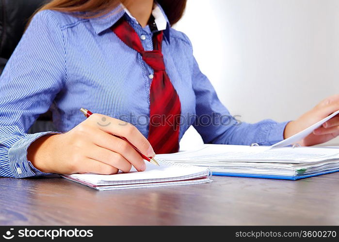 Business woman at office sitting at table and working