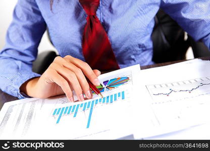 Business woman at office sitting at table and working