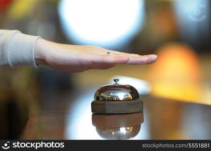 business woman at the reception of a hotel checking in