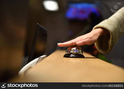 business woman at the reception of a hotel checking in