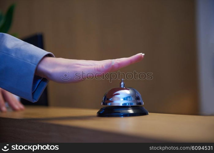 business woman at the reception of a hotel checking in