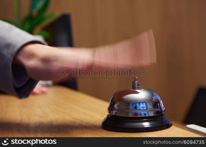 business woman at the reception of a hotel checking in