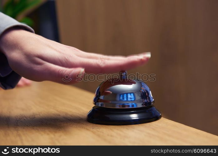 business woman at the reception of a hotel checking in