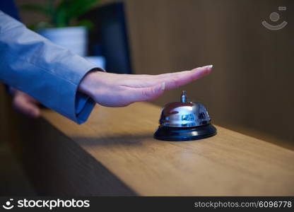 business woman at the reception of a hotel checking in