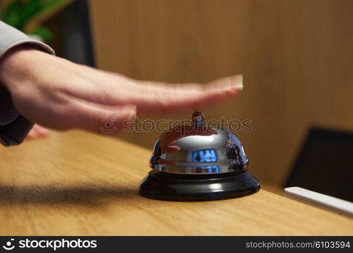 business woman at the reception of a hotel checking in