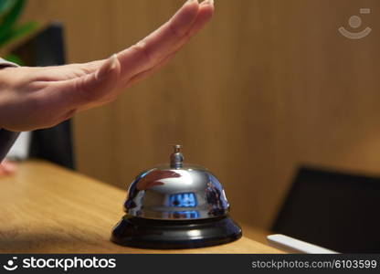 business woman at the reception of a hotel checking in