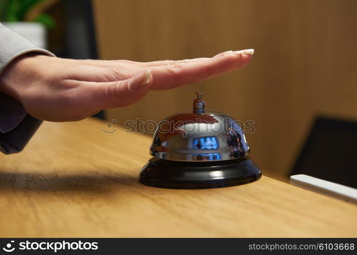 business woman at the reception of a hotel checking in