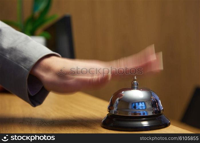 business woman at the reception of a hotel checking in