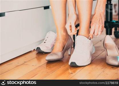 business woman changing to sports shoes