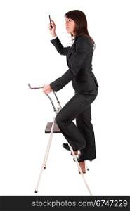 Business woman climbing ladder, isolated over white