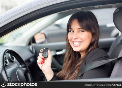 Business woman driving her new sports car