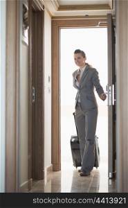 Business woman entering hotel room
