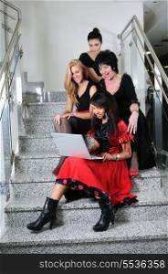 business woman group team work on laptop at staircase