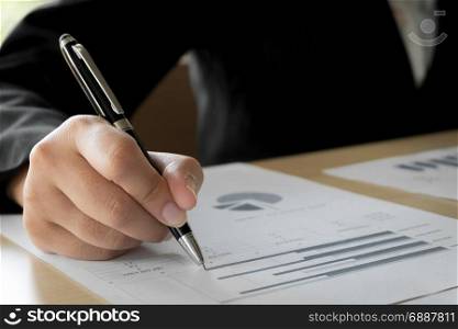 business woman hands analyzing valuation on data documents