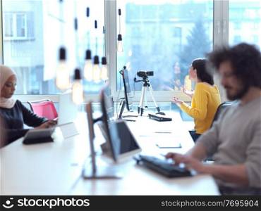 business woman have online meeting  in modern open space coworking office as influencer making podcat or tutorial videos