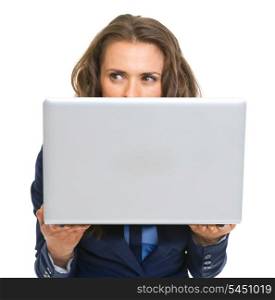 Business woman hiding behind laptop