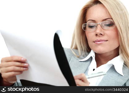 business woman hold a folder of papers and write