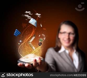 Business woman holding a mobile phone sending images