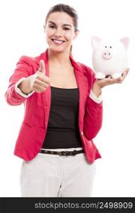 Business woman holding a piggy bank and doing thumbs up, isolated over a white background