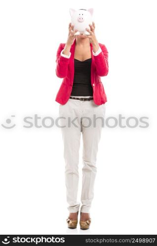 Business woman holding a piggy bank in front of the face, isolated over a white background