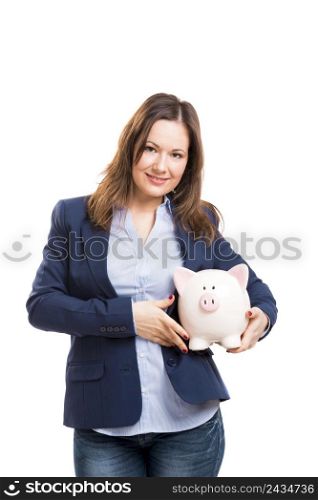 Business woman holding a piggy bank, isolated over white background